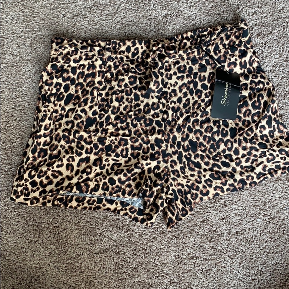Cheetah print soft shorts with belt. NEVER WORN